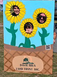 Booth visitor at Davie Land Trust Orange Blossom festival-10