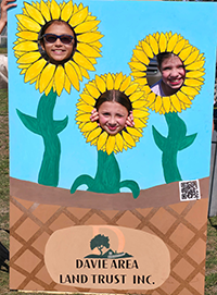 Booth visitor at Davie Land Trust Orange Blossom festival-11
