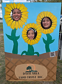 Booth visitor at Davie Land Trust Orange Blossom festival-13