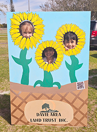 Booth visitor at Davie Land Trust Orange Blossom festival-3