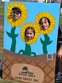 Booth visitor at Davie Land Trust Orange Blossom festival-4